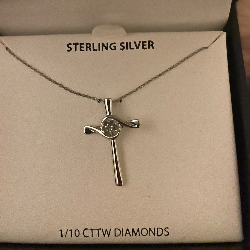 Sterling silver cross pendant on dainty 18” chain with diamonds.